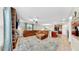 Spacious living room with a large sectional couch, tile floors, and open access to kitchen at 17102 Yellow Pine St, Wimauma, FL 33598