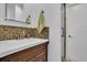 Bathroom featuring an updated vanity, with new sink, faucet, and a modern tile backsplash at 1742 Mississippi Ne Ave, St Petersburg, FL 33703