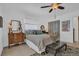 Comfortable bedroom featuring a ceiling fan, dresser, nightstand, and sliding door closet at 1742 Mississippi Ne Ave, St Petersburg, FL 33703