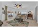 Well-lit bedroom with ceiling fan, area rug and a sliding door that leads to a screened in porch at 1742 Mississippi Ne Ave, St Petersburg, FL 33703