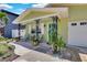Inviting home featuring a front porch with seating and a well-maintained, xeriscaped yard at 1742 Mississippi Ne Ave, St Petersburg, FL 33703