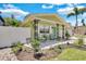 Charming home with a quaint front porch, decorative ironwork, and landscaped garden at 1742 Mississippi Ne Ave, St Petersburg, FL 33703