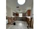 Partially renovated kitchen with tiled floors, showing an opportunity for customization and remodel at 1742 Mississippi Ne Ave, St Petersburg, FL 33703
