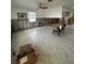 Partially renovated living room with tiled floors, and updated windows, showing an opportunity for customization at 1742 Mississippi Ne Ave, St Petersburg, FL 33703