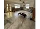 Partially renovated living room with tiled floors, and updated windows, showing an opportunity for customization at 1742 Mississippi Ne Ave, St Petersburg, FL 33703