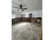 Spacious living room featuring a ceiling fan and access to other rooms in the house at 1742 Mississippi Ne Ave, St Petersburg, FL 33703