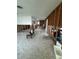 Open living room with tile flooring, exposed framing, and natural light at 1742 Mississippi Ne Ave, St Petersburg, FL 33703