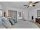 Bright main bedroom with a ceiling fan, soft lighting and artwork on the walls at 1742 Mississippi Ne Ave, St Petersburg, FL 33703