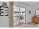 A sunroom features glass sliding doors, a standing cabinet, and a view of the outside at 1742 Mississippi Ne Ave, St Petersburg, FL 33703