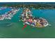 Waterfront neighborhood featuring lush landscaping, docks, and houses set along the scenic bay waters and canals at 26 Sunset Bay Drive, Belleair, FL 33756