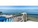 Balcony overlooking waterfront and pool offers stunning views at 26 Sunset Bay Drive, Belleair, FL 33756