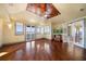 Bedroom featuring hardwood floors, water views, and private balcony access at 26 Sunset Bay Drive, Belleair, FL 33756