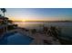 Beautiful pool with waterfront views and dock; the perfect place to relax and enjoy the sunset at 26 Sunset Bay Drive, Belleair, FL 33756