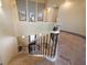 Staircase with ornate iron railing and tile steps providing access to multiple levels at 26 Sunset Bay Drive, Belleair, FL 33756