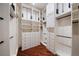 A large, organized walk-in closet with custom shelving, drawers, and hanging rods at 26 Sunset Bay Drive, Belleair, FL 33756