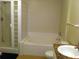 Clean bathroom featuring a glass-enclosed shower, tub, and single vanity with granite countertop at 501 Knights Run Ave # 2119, Tampa, FL 33602
