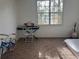 Bright bedroom with a large window, decorated with a keyboard, guitar and other items at 501 Knights Run Ave # 2119, Tampa, FL 33602