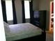 Comfortable bedroom with plush mattress, dark wood furniture, and natural light from a large window at 501 Knights Run Ave # 2119, Tampa, FL 33602