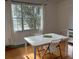 Bright dining area with a table near a window, creating a pleasant space for meals and gatherings at 501 Knights Run Ave # 2119, Tampa, FL 33602