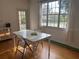 Bright dining area with a table near a window, creating a pleasant space for meals and gatherings at 501 Knights Run Ave # 2119, Tampa, FL 33602