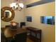 Charming dining room featuring a round mirror, chandelier, and wooden dining set, creating a cozy atmosphere at 501 Knights Run Ave # 2119, Tampa, FL 33602