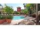 Inviting community pool area with lounge chairs and lush landscaping, perfect for relaxation and leisure at 501 Knights Run Ave # 2119, Tampa, FL 33602