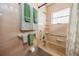 Clean bathroom with a tiled tub, shower, and neutral colored walls at 6226 Hampton N Ct, St Petersburg, FL 33710