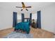 Cozy bedroom with a wooden bed frame, blue bedding, and matching blue curtains at 6226 Hampton N Ct, St Petersburg, FL 33710