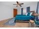 Well-lit bedroom featuring a wooden bed frame, blue bedding, and a closet at 6226 Hampton N Ct, St Petersburg, FL 33710