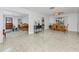 Open layout featuring living room, dining area with a wooden table, and bright natural light at 6226 Hampton N Ct, St Petersburg, FL 33710