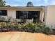 Charming home featuring a beautiful garden with vibrant flowers and a well-maintained lawn at 6226 Hampton N Ct, St Petersburg, FL 33710