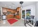 Modern kitchen with stainless steel appliances, wooden cabinets, and a view to the patio at 6226 Hampton N Ct, St Petersburg, FL 33710