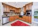 Well-equipped kitchen with stainless steel appliances, granite countertops and wooden cabinetry at 6226 Hampton N Ct, St Petersburg, FL 33710