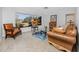 Bright living room with a large window offering views of the outdoors and comfortable seating at 6226 Hampton N Ct, St Petersburg, FL 33710