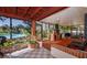 Relaxing sunroom featuring brick accents, tile flooring, and a view of the backyard pool area at 6226 Hampton N Ct, St Petersburg, FL 33710