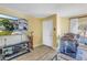 Welcoming entryway featuring a front door, a television with home view, and cozy interior elements at 8954 Antigua Dr, Seminole, FL 33777