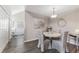 Cozy dining area featuring a round table, chairs, and modern decor, perfect for intimate meals and gatherings at 3300 Haviland Ct # 303, Palm Harbor, FL 34684