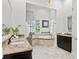 Bright bathroom with double vanity, soaking tub, and glass shower at 4023 W Horatio St, Tampa, FL 33609