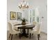 Cozy dining area featuring an elegant chandelier and plenty of natural light at 4023 W Horatio St, Tampa, FL 33609