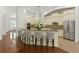 Spacious kitchen featuring stainless steel appliances, a breakfast bar, and ample cabinet space at 4023 W Horatio St, Tampa, FL 33609