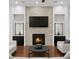 Elegant living room showcasing a stone fireplace, recessed lighting, and stylish decor at 4023 W Horatio St, Tampa, FL 33609