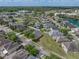 An aerial view of a home featuring a lush backyard, a white fence, and neighborhood views at 4351 Highcroft Dr, Wesley Chapel, FL 33545
