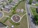 The aerial view showcases a playground and picnic area nestled in a lush, well-planned community at 4351 Highcroft Dr, Wesley Chapel, FL 33545