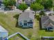 Aerial view of the home's backyard showing a large grassy area and covered patio at 4351 Highcroft Dr, Wesley Chapel, FL 33545