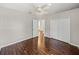 Bedroom featuring wood floors, a ceiling fan, and a closet, offering a relaxing and comfortable space at 4351 Highcroft Dr, Wesley Chapel, FL 33545