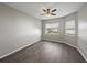 Neutral bedroom with natural light, wood-look flooring, and ample space at 4351 Highcroft Dr, Wesley Chapel, FL 33545