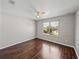 Bedroom with hardwood floors, neutral walls, and a bright window at 4351 Highcroft Dr, Wesley Chapel, FL 33545
