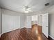 Bedroom featuring wood floors, a ceiling fan, and a closet provides a comfortable living space at 4351 Highcroft Dr, Wesley Chapel, FL 33545