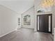Open entryway boasting high ceilings, stylish chandelier, and an eye-catching front door at 4351 Highcroft Dr, Wesley Chapel, FL 33545