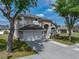 Charming home with a two-car garage, neat landscaping, and mature trees enhancing its curb appeal at 4351 Highcroft Dr, Wesley Chapel, FL 33545
